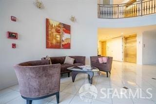 living room with light tile patterned floors