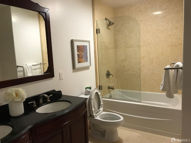 full bathroom with vanity, toilet, and tiled shower / bath