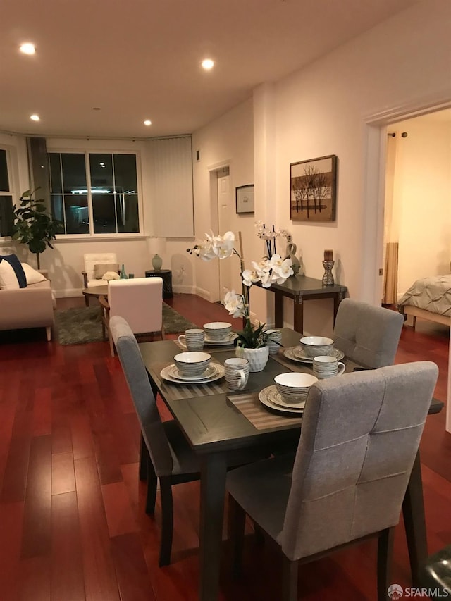 dining room with dark hardwood / wood-style floors