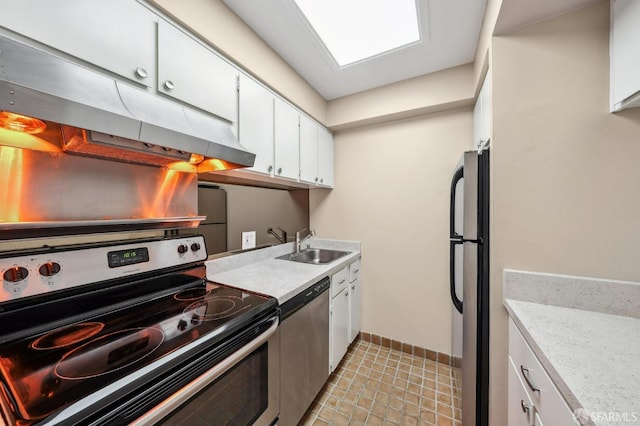 kitchen with stainless steel appliances, white cabinetry, and sink