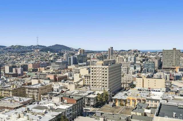 property's view of city with a mountain view