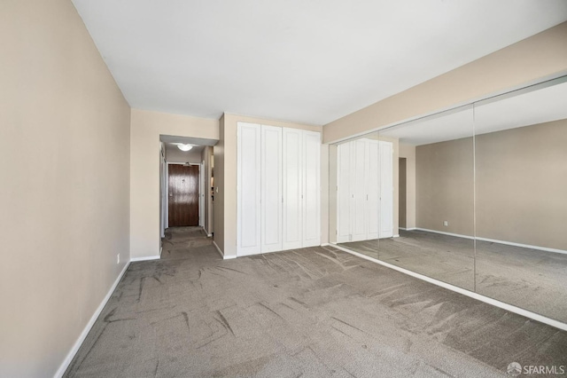 unfurnished bedroom featuring carpet flooring