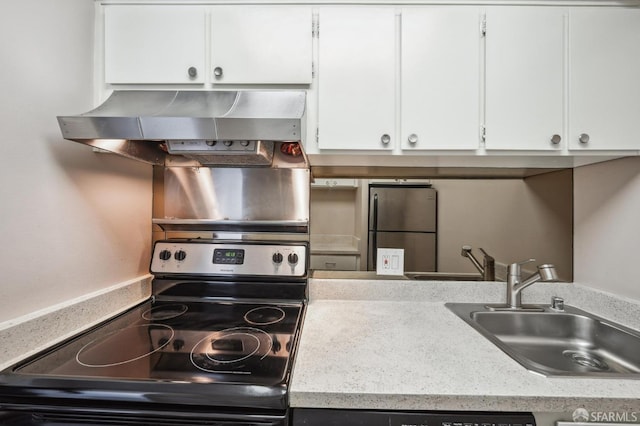 kitchen featuring white cabinetry, sink, range hood, and appliances with stainless steel finishes