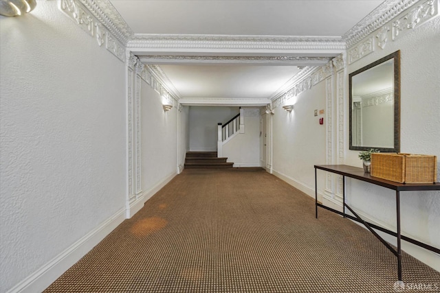 hallway featuring crown molding and carpet floors