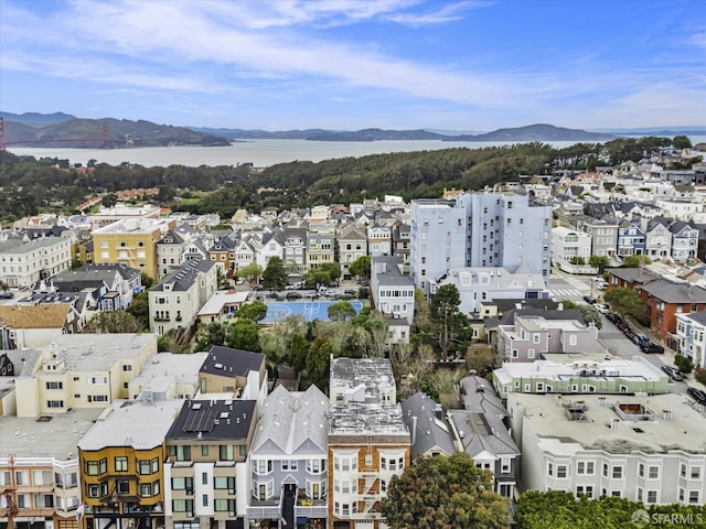 bird's eye view with a water and mountain view