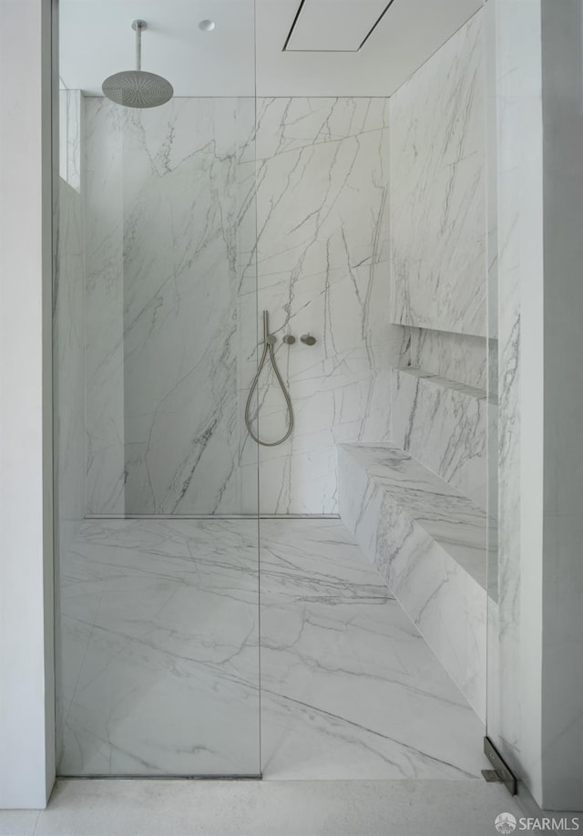 interior space with a tile shower