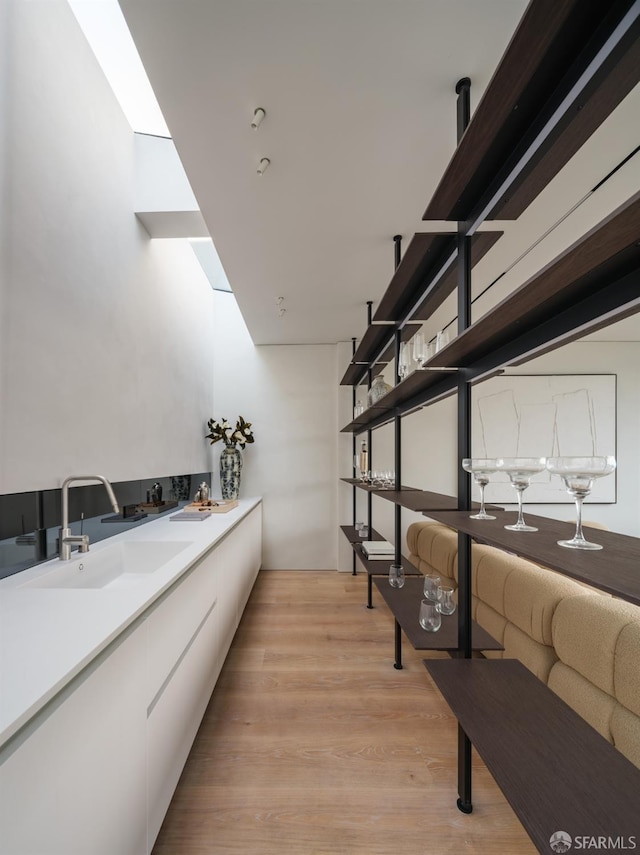 interior space featuring sink and hardwood / wood-style floors