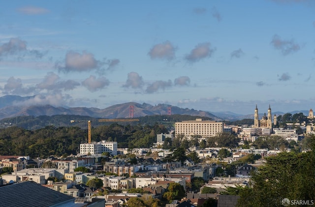 property's view of city featuring a mountain view