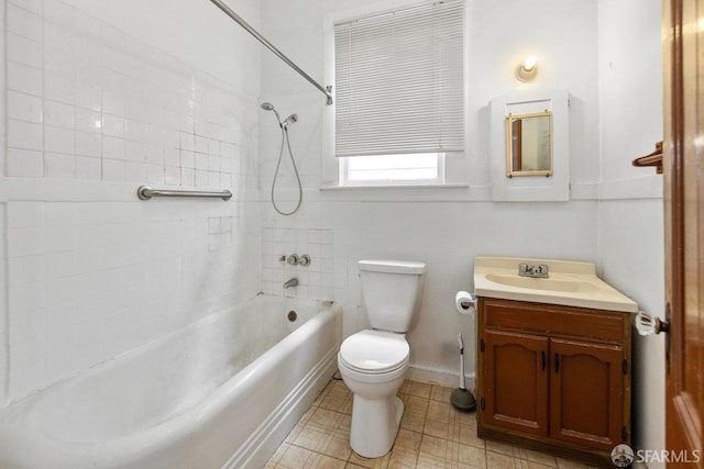 full bathroom with vanity, tiled shower / bath combo, and toilet