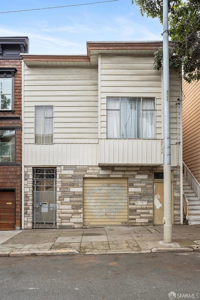 multi unit property featuring a garage