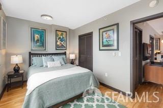 bedroom with wood finished floors