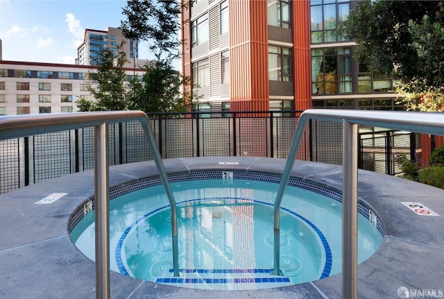 view of pool with a community hot tub