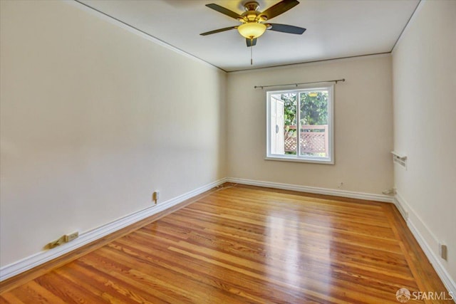 3675 Fillmore St Unit 102, San Francisco, CA 94123 - empty room with wood finished floors, a ceiling fan, baseboards, and crown molding