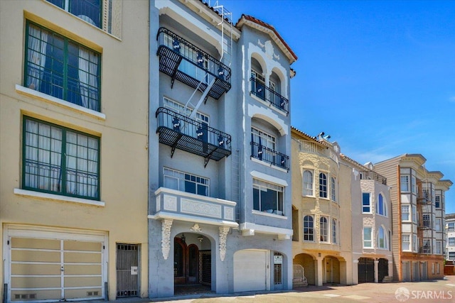 3675 Fillmore St Unit 102, San Francisco, CA 94123 - view of building exterior featuring a garage