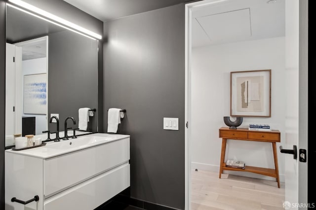 bathroom featuring vanity and hardwood / wood-style flooring