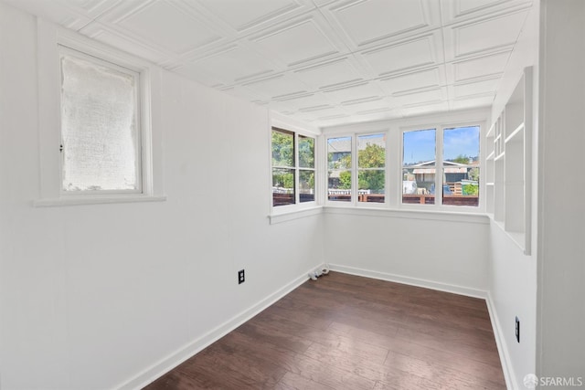 2875 Sunset Ave, Oakland, CA 94601 - spare room with dark wood-type flooring, baseboards, and an ornate ceiling