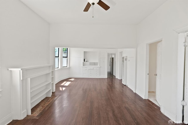 2875 Sunset Ave, Oakland, CA 94601 - unfurnished living room featuring ceiling fan, dark wood-style flooring, and baseboards