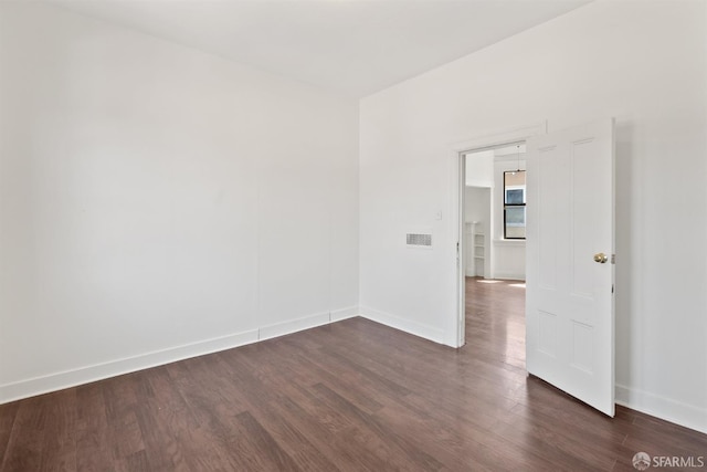 2875 Sunset Ave, Oakland, CA 94601 - spare room with baseboards and dark wood finished floors
