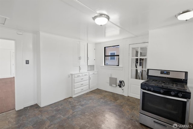 2875 Sunset Ave, Oakland, CA 94601 - kitchen with stainless steel range with gas cooktop, white cabinets, and light countertops