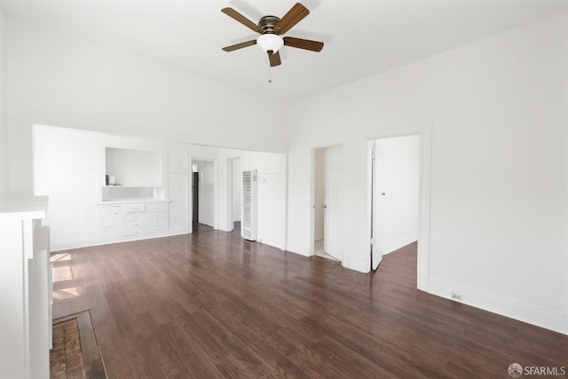 2875 Sunset Ave, Oakland, CA 94601 - unfurnished living room featuring a ceiling fan, dark wood-type flooring, baseboards, and a heating unit