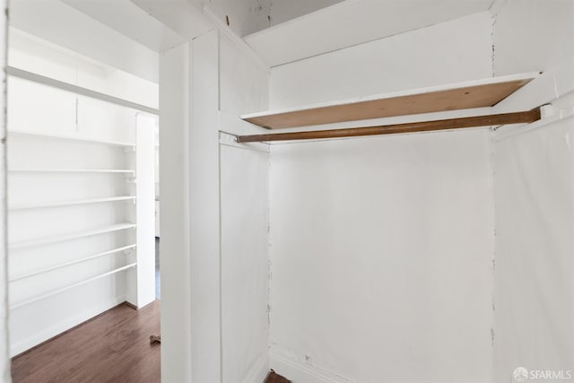 2875 Sunset Ave, Oakland, CA 94601 - walk in closet with dark wood-style flooring