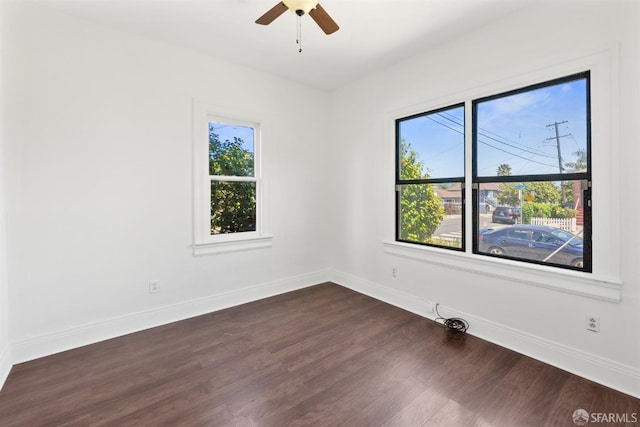 2875 Sunset Ave, Oakland, CA 94601 - empty room featuring plenty of natural light, baseboards, dark wood finished floors, and a ceiling fan