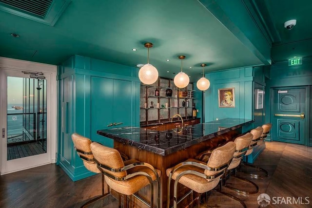425 1st St Unit 3301, San Francisco, CA 94105 - indoor wet bar with a decorative wall, dark wood-type flooring, and hanging light fixtures