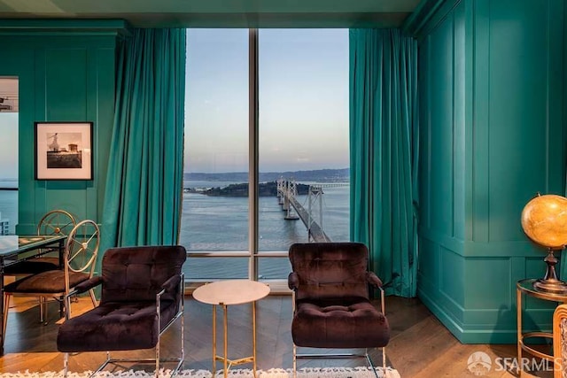 425 1st St Unit 3301, San Francisco, CA 94105 - living area featuring a decorative wall, wood finished floors, and a water view