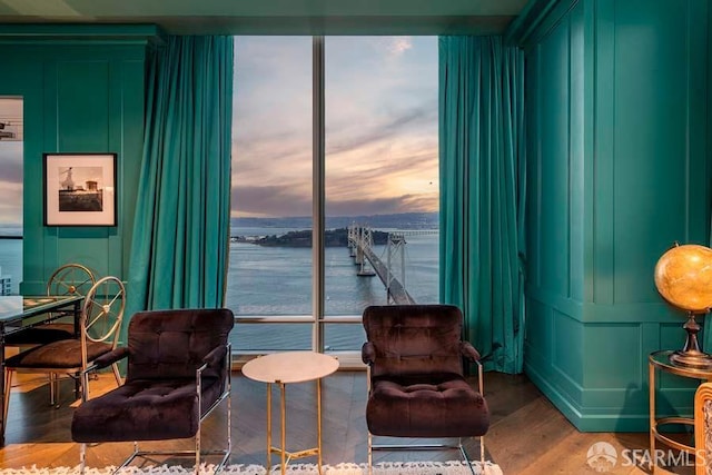 425 1st St Unit 3301, San Francisco, CA 94105 - living area with a decorative wall, wood finished floors, a water view, and plenty of natural light