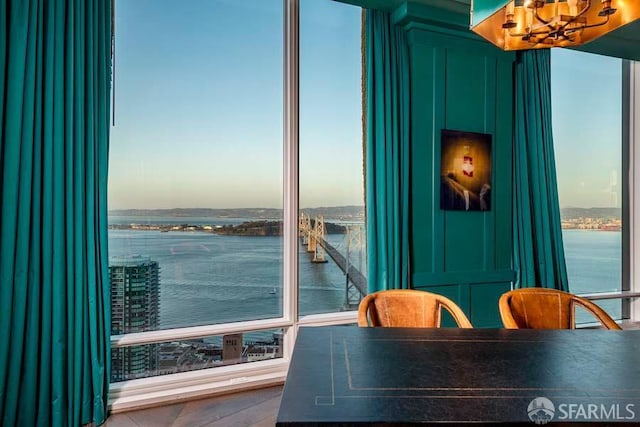 425 1st St Unit 3301, San Francisco, CA 94105 - dining room featuring a water view and a chandelier