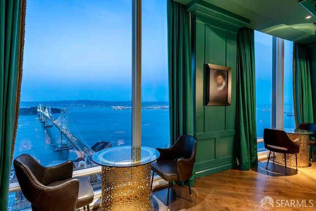 425 1st St Unit 3301, San Francisco, CA 94105 - dining space featuring a water view and wood finished floors