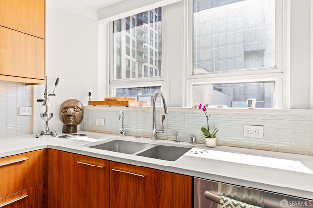 1615 Broadway Unit 5, Oakland, CA 94612 - kitchen with a sink, stainless steel dishwasher, backsplash, and modern cabinets
