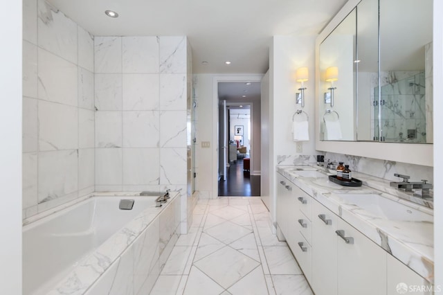 bathroom featuring vanity and separate shower and tub