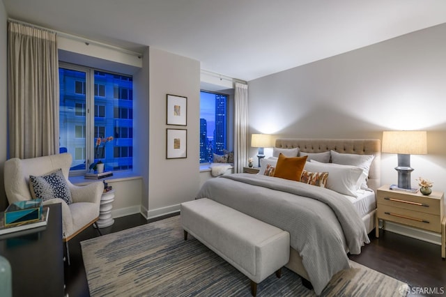 bedroom featuring dark hardwood / wood-style flooring