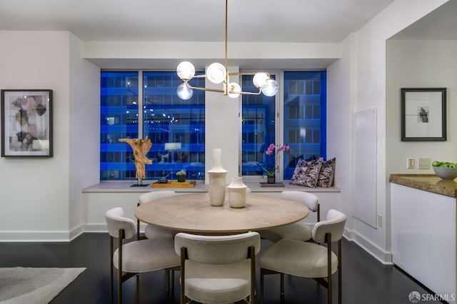 dining area with dark hardwood / wood-style flooring