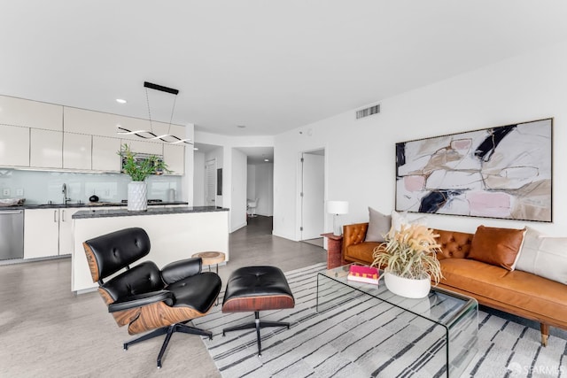 living room featuring visible vents