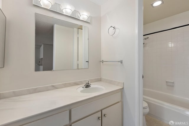 full bathroom with bathtub / shower combination, vanity, and toilet