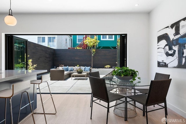 dining area with light wood-type flooring