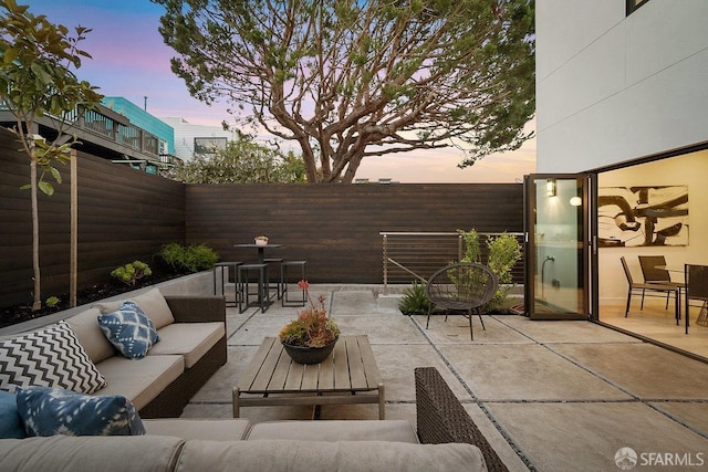 patio terrace at dusk with an outdoor hangout area