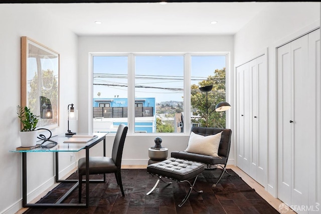 office with wood-type flooring and plenty of natural light