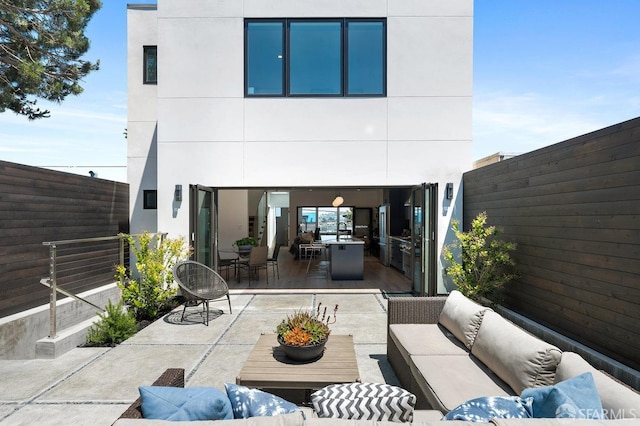 exterior space featuring outdoor lounge area and sink