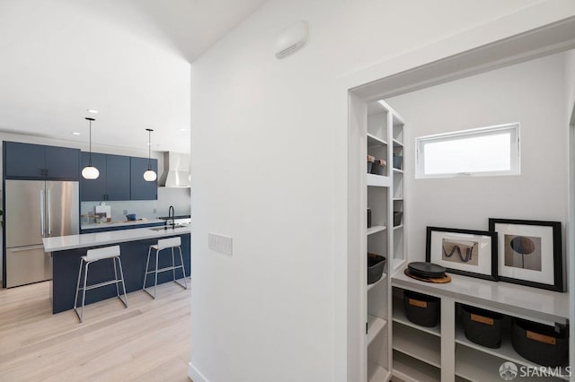 interior space featuring sink and light hardwood / wood-style floors