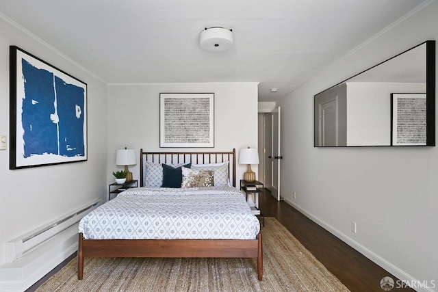 bedroom featuring ornamental molding, wood finished floors, baseboards, and a baseboard radiator