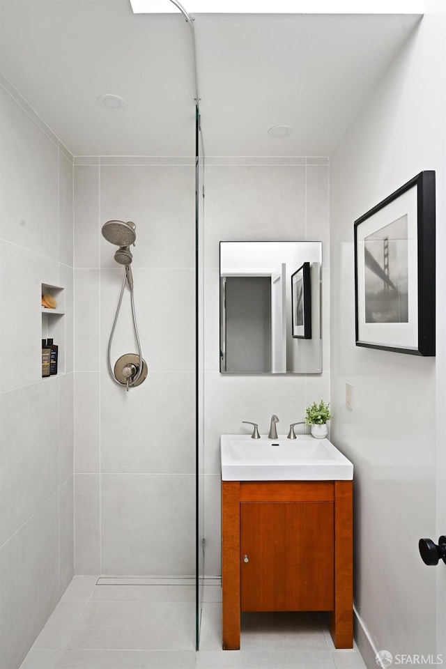 bathroom featuring vanity and a tile shower