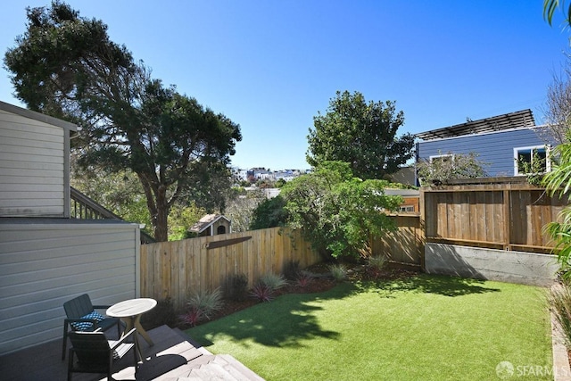 view of yard featuring a fenced backyard