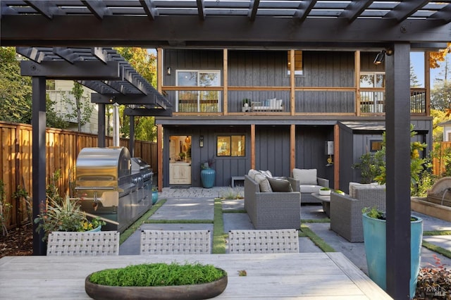 view of patio with a balcony, a pergola, grilling area, and outdoor lounge area