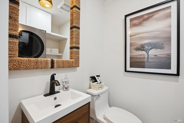 bathroom with vanity and toilet