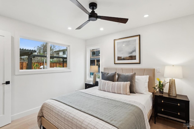 bedroom with hardwood / wood-style floors and ceiling fan