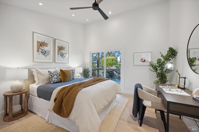 bedroom featuring light wood-type flooring, access to exterior, and ceiling fan