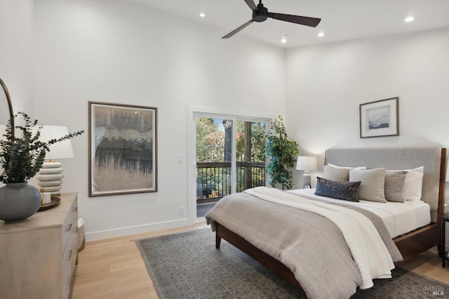 bedroom with ceiling fan, access to exterior, and light hardwood / wood-style floors